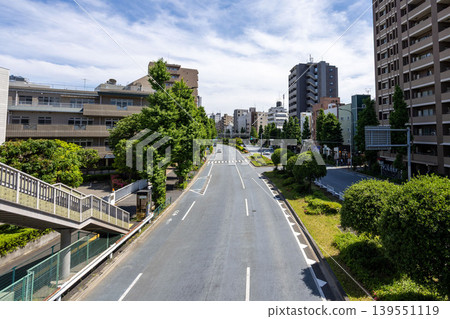 A view of the wide road and apartment complex on Hakusan Street in Tokyo. A view of the wide road and apartment complex on Hakusan Street in Tokyo. 139551119