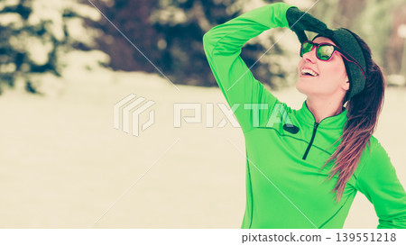 Woman fit sport model training outdoor on cold day 139551218