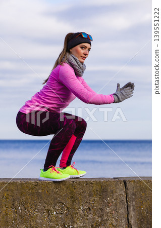 Woman fitness sport girl training outdoor in cold weather 139551222