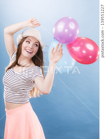 Woman summer joyful girl with colorful balloons Woman summer joyful girl with colorful balloons 139551227