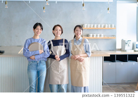 A woman working in a cafe A woman working in a cafe 139551322