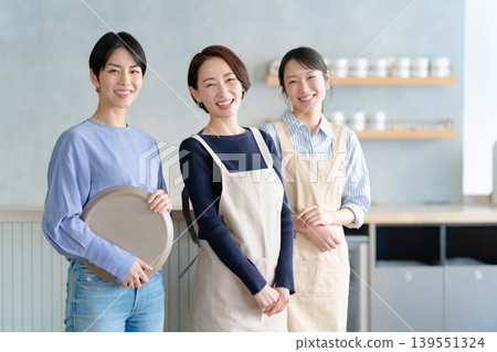 A woman working in a cafe A woman working in a cafe 139551324