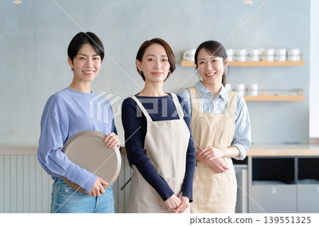 A woman working in a cafe A woman working in a cafe 139551325