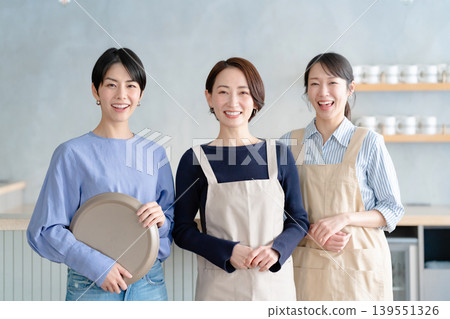 A woman working in a cafe A woman working in a cafe 139551326