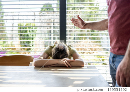 Father threatening daughter with punishment at home. 139551392