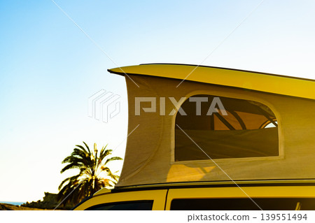 Camper van with tent on roof on beach Camper van with tent on roof on beach 139551494