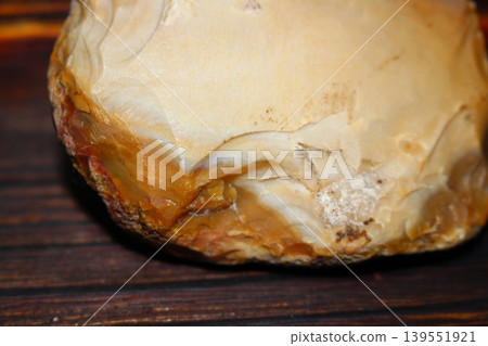 Roughly chipped flint edge, an ancient tool Roughly chipped flint edge, an ancient tool 139551921