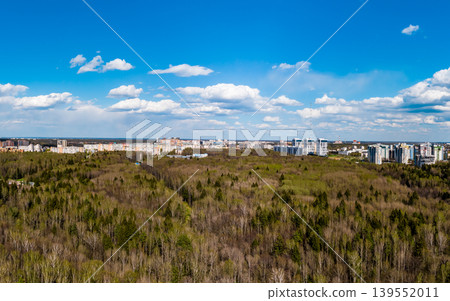 Panoramic drone view of the city behind the forest Panoramic drone view of the city behind the forest 139552011