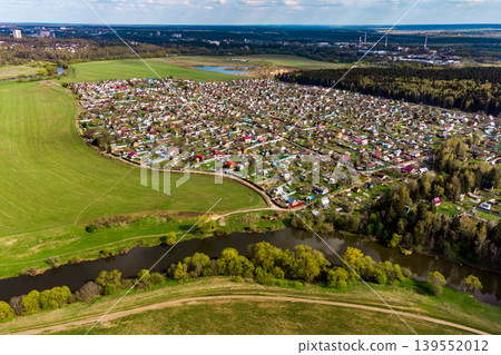Dense dacha development near the river, view from a great height Dense dacha development near the river, view from a great height 139552012