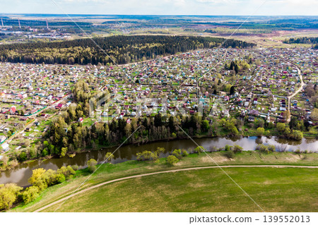 Dense dacha development near the river, view from a great height Dense dacha development near the river, view from a great height 139552013