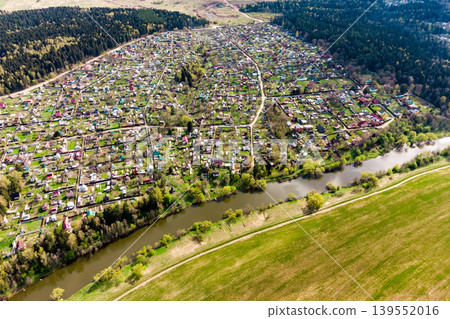 Dense dacha development near the river, view from a great height 139552016