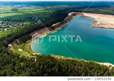 Aerial view of a flooded sand quarry in the countryside. Bolotsky quarry, Kaluga region 139552550