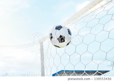 Soccer Ball Hitting the Back of the Net, Action Shot of Scoring a Goal in Football Match Soccer Ball Hitting the Back of the Net, Action Shot of Scoring a Goal in Football Match 139553430