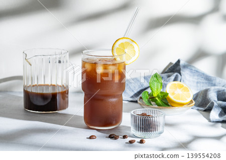 Cold Coffee Tonic Drink With Lemon and Ice 139554208