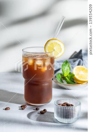Cold Coffee Tonic Drink With Lemon and Ice 139554209