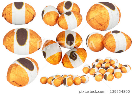 Chocolate balls wrapped in foil isolated on white background Chocolate balls wrapped in foil isolated on white background 139554800