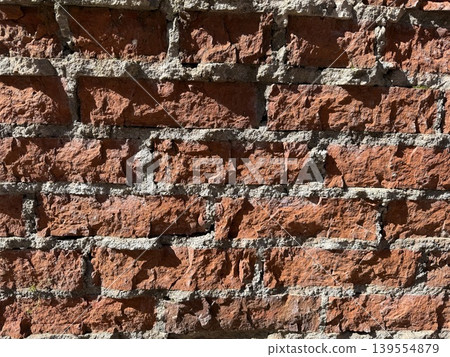 Brick wall texture showing detailed red and gray patterns useful as a background Brick wall texture showing detailed red and gray patterns useful as a background 139554879