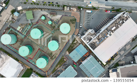 Aerial drone footage of a factory landscape from directly above. Aerial drone footage of a factory landscape from directly above. 139555054