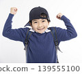 Excited Little boy wearing baseball cap isolated on white 139555100