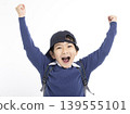 Excited Little boy wearing baseball cap isolated on white 139555101