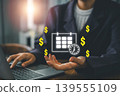 Business professional using a laptop with floating dollar signs and calendar icons, symbolizing time management and financial success. 139555109
