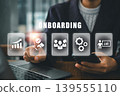 Business professional interacts with digital onboarding interface, highlighting technology and teamwork. 139555110