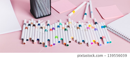 Colored acrylic markers for creativity and notebooks on the table web banner Colored acrylic markers for creativity and notebooks on the table web banner 139556039