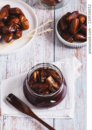 Sweet caramel made from fresh dates on the table vertical view Sweet caramel made from fresh dates on the table vertical view 139556052