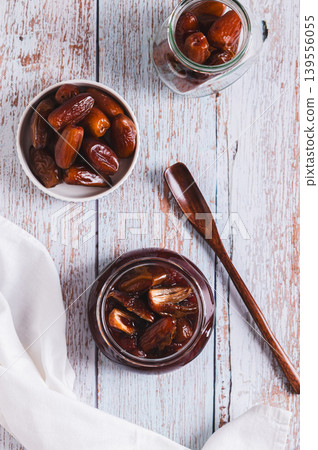 Sweet caramel made from fresh dates on the table top and vertical view Sweet caramel made from fresh dates on the table top and vertical view 139556055