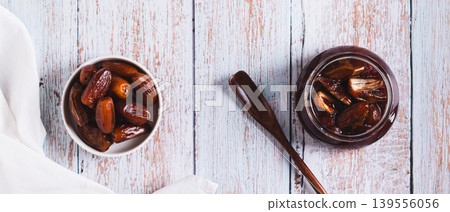 Sweet caramel made from fresh dates on the table top view web banner Sweet caramel made from fresh dates on the table top view web banner 139556056