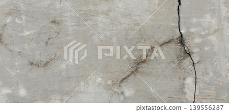 Grey concrete surface texture with aesthetic natural cracks. 139556287