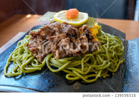 Kawara Soba, a specialty of Yamaguchi Prefecture, is a local dish featuring fragrant green tea soba noodles and beef. Kawara Soba, a specialty of Yamaguchi Prefecture, is a local dish featuring fragrant green tea soba noodles and beef. 139556318
