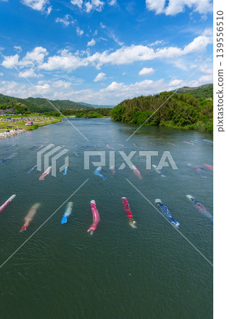Saba River, Hofu City, Yamaguchi Prefecture: Carp streamers swimming in the water and the Saba River Koinagashi festival. Saba River, Hofu City, Yamaguchi Prefecture: Carp streamers swimming in the water and the Saba River Koinagashi festival. 139556510