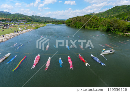 Saba River, Hofu City, Yamaguchi Prefecture: Carp streamers swimming in the water and the Saba River Koinagashi festival. Saba River, Hofu City, Yamaguchi Prefecture: Carp streamers swimming in the water and the Saba River Koinagashi festival. 139556526