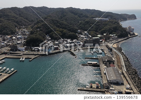 Aerial photograph capturing the fishing port and coastal settlements of Kada, Wakayama Prefecture. Aerial photograph capturing the fishing port and coastal settlements of Kada, Wakayama Prefecture. 139556678