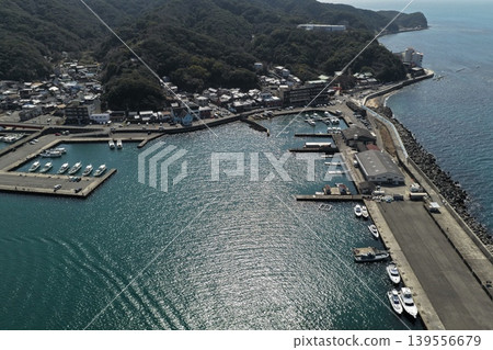 An aerial photograph overlooking Kada Port and the surrounding fishing village in Wakayama Prefecture. An aerial photograph overlooking Kada Port and the surrounding fishing village in Wakayama Prefecture. 139556679