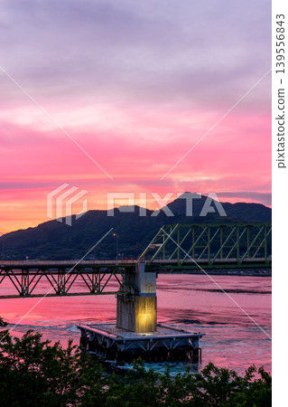 A spectacular view of the Oshima Bridge and Honshu at sunset, as seen from Suo-Oshima Island. A spectacular view of the Oshima Bridge and Honshu at sunset, as seen from Suo-Oshima Island. 139556843