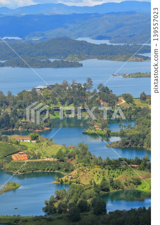 The breathtaking scenery of Lake Guatapé, Colombia: Green islands and blue lake waters as seen from El Peñón. The breathtaking scenery of Lake Guatapé, Colombia: Green islands and blue lake waters as seen from El Peñón. 139557023