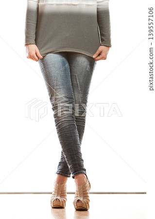 woman legs in denim trousers high heels shoes 139557106