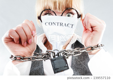 Furious woman with chained hands and contract 139557110