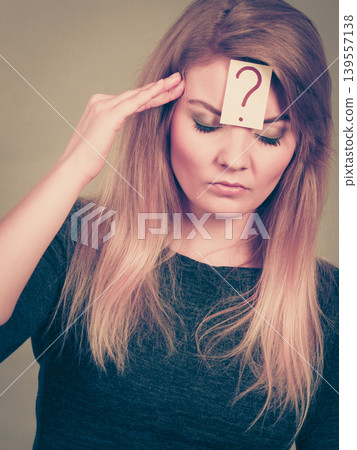 Closeup of woman thinking face expression Closeup of woman thinking face expression 139557138