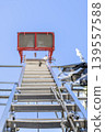 Exterior wall renovation site of a detached house; electric ladder 139557588