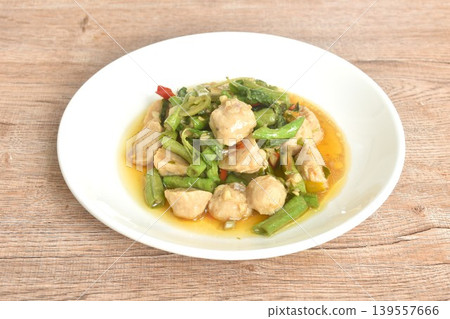 spicy stir fried yard long bean and pork meatball with chili couple basil on plate 139557666