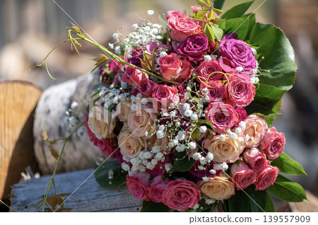 Wedding Rose Bouquet on Weathered Wood Background Wedding Rose Bouquet on Weathered Wood Background 139557909