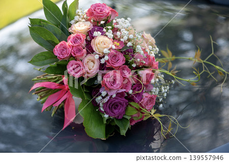 Wedding Bouquet Resting on Car Hood 139557946