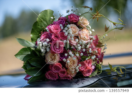 Bridal Bouquet on Car with Countryside Background Bridal Bouquet on Car with Countryside Background 139557949
