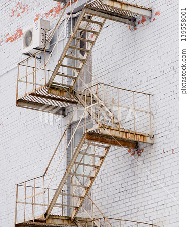 Close View Of Rusted Fire Escape Stairs Close View Of Rusted Fire Escape Stairs 139558001