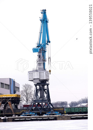 Large Harbor Crane Standing Over Frozen Industrial Port 139558021
