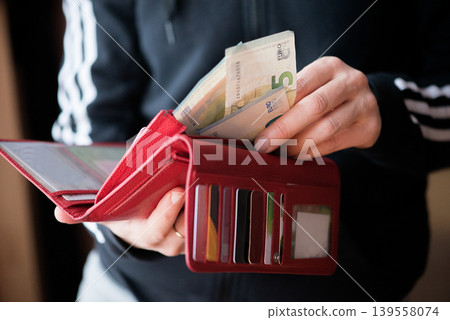 Red Leather Wallet With Euro Banknotes Red Leather Wallet With Euro Banknotes 139558074