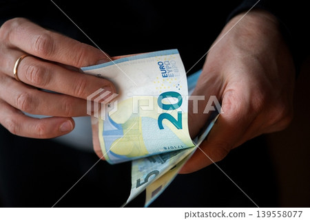 Counting Euro Banknotes In Hands Counting Euro Banknotes In Hands 139558077